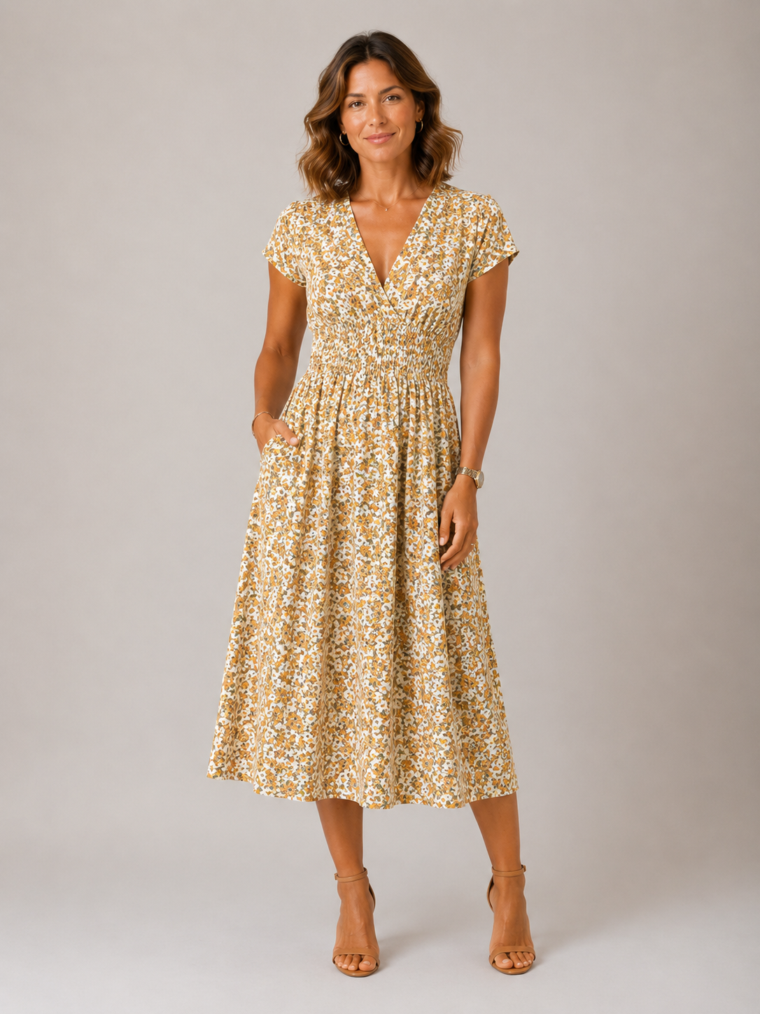 Woman wearing a floral dress against a plain background