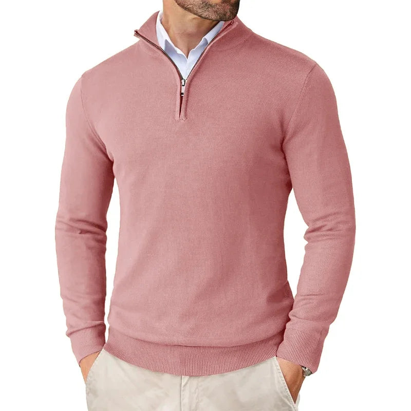 Pink sweater worn by a person on a white background