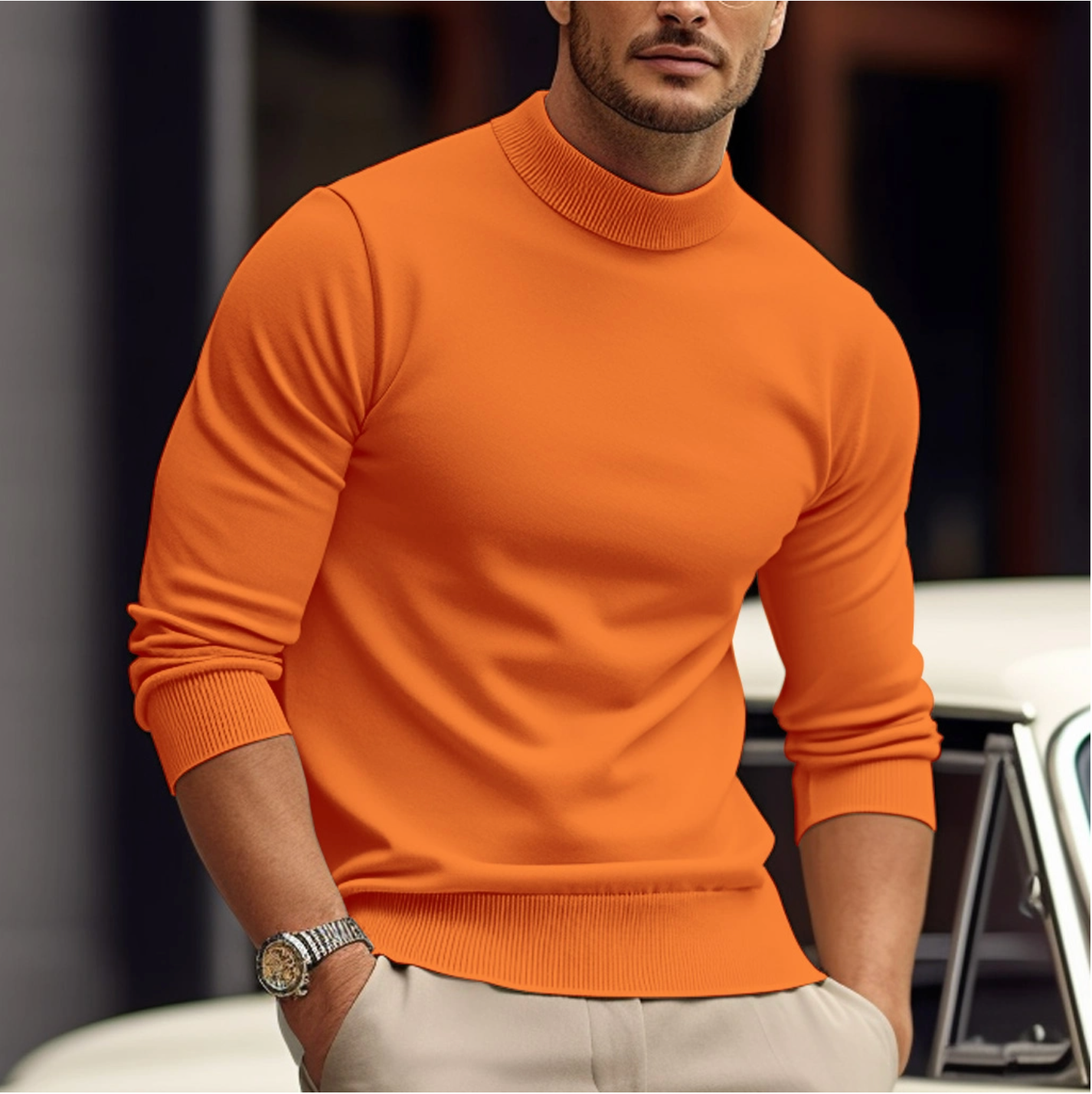 Man wearing an orange sweater with a blurred background