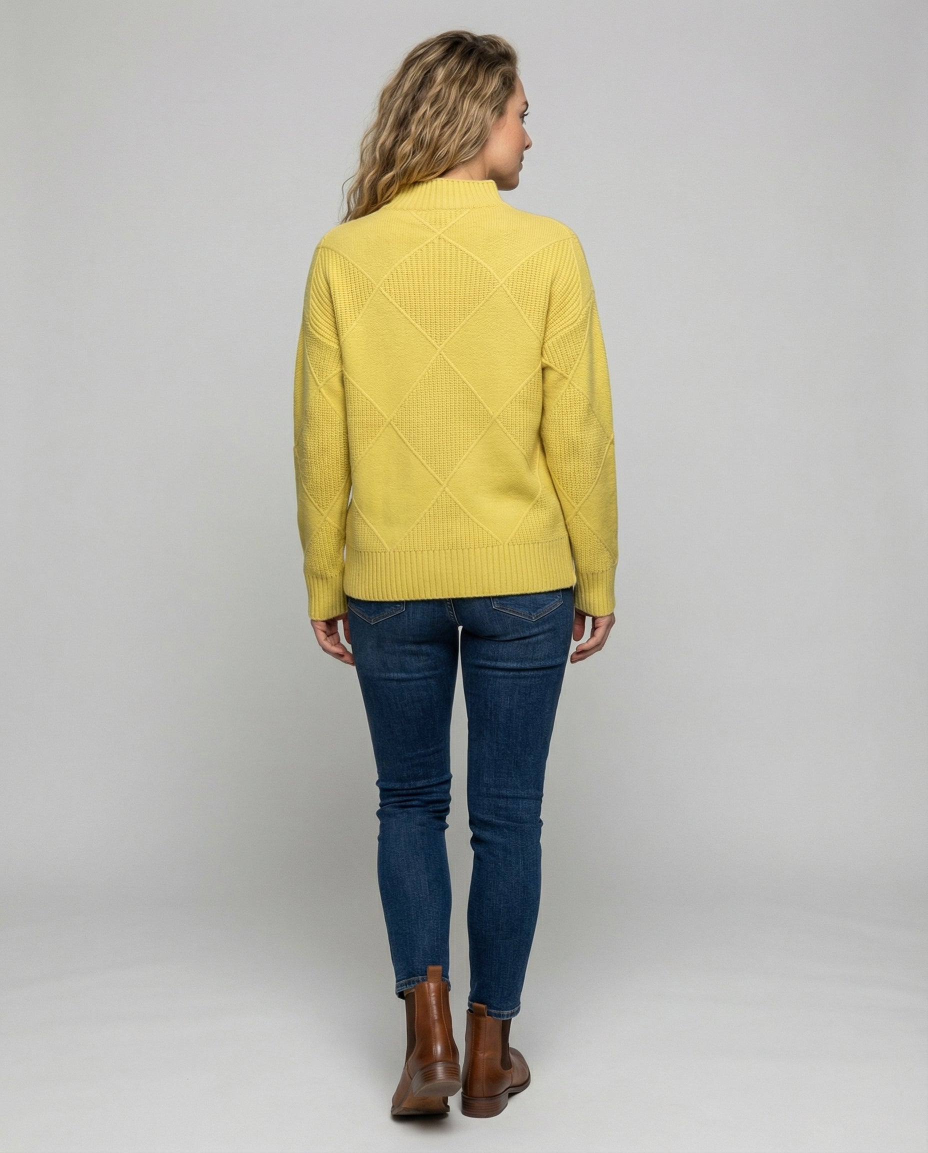 Women’s soft turtleneck sweater in yellow, warm and comfortable, stylish for casual and elegant winter outfits.