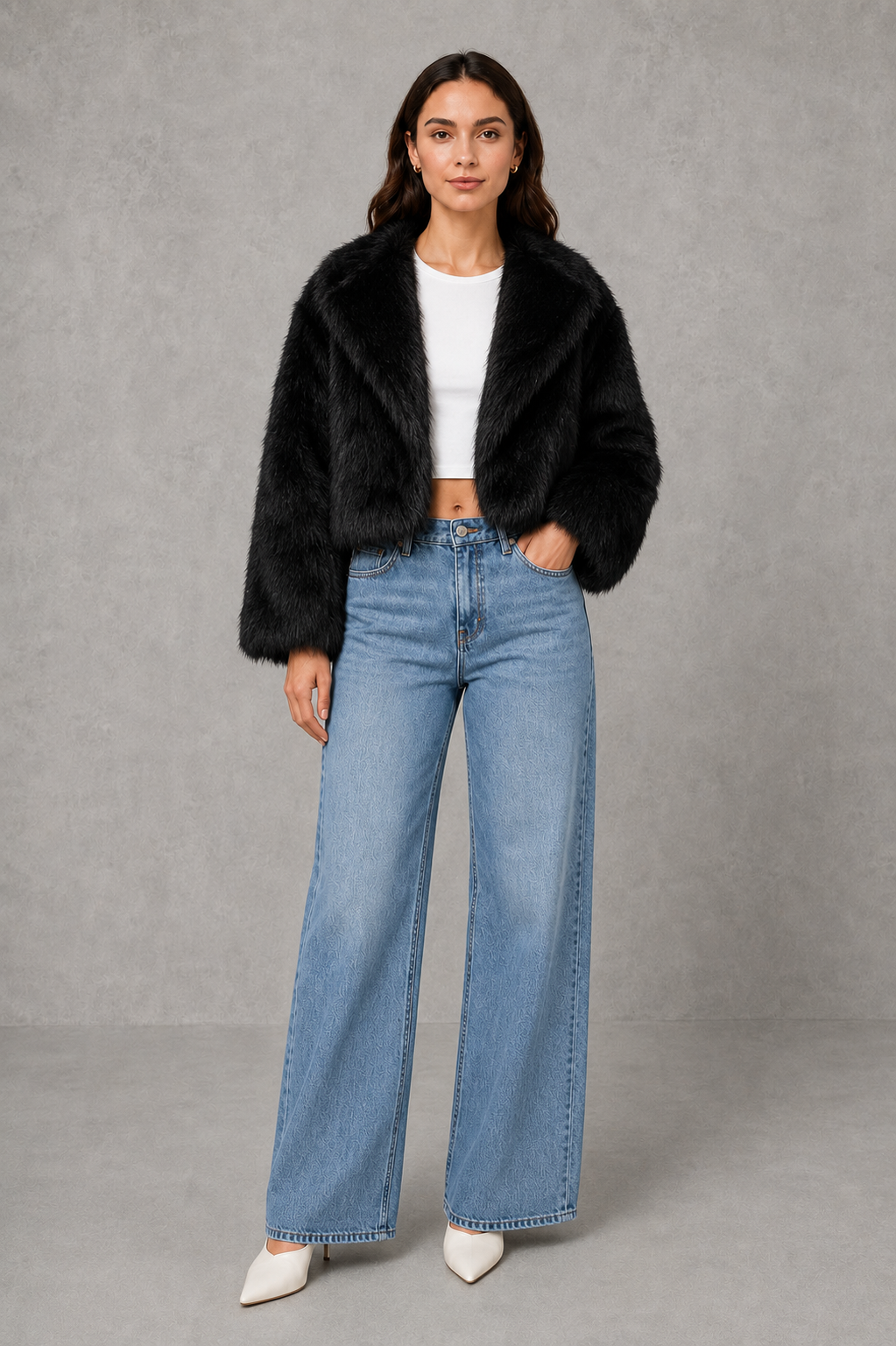Women’s black faux fur coat with a soft plush texture, refined tailored silhouette and elegant finish for autumn and winter styling.