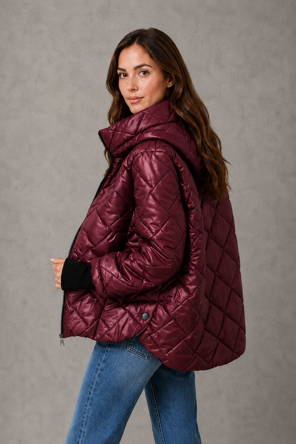 Women’s burgundy quilted puffer jacket with lightweight padding, a high collar, tailored silhouette and practical side pockets for winter wear.