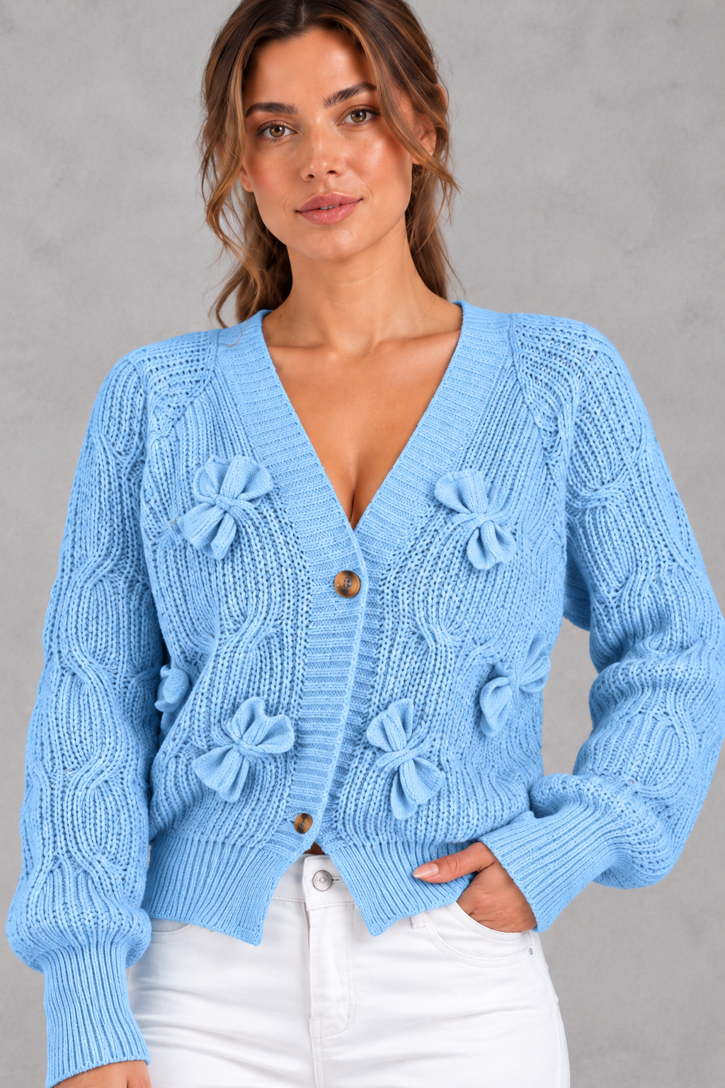 Women's cable knit bow cardigan in Light Blue – close-up