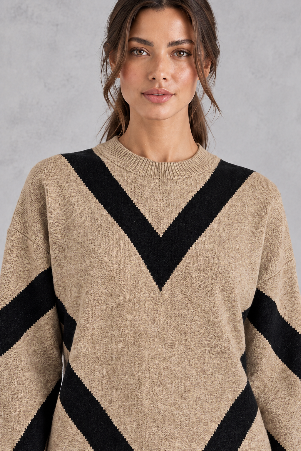 Women’s chevron knit crew neck jumper with a bold V-shaped pattern, dropped shoulders, long sleeves and ribbed trims.