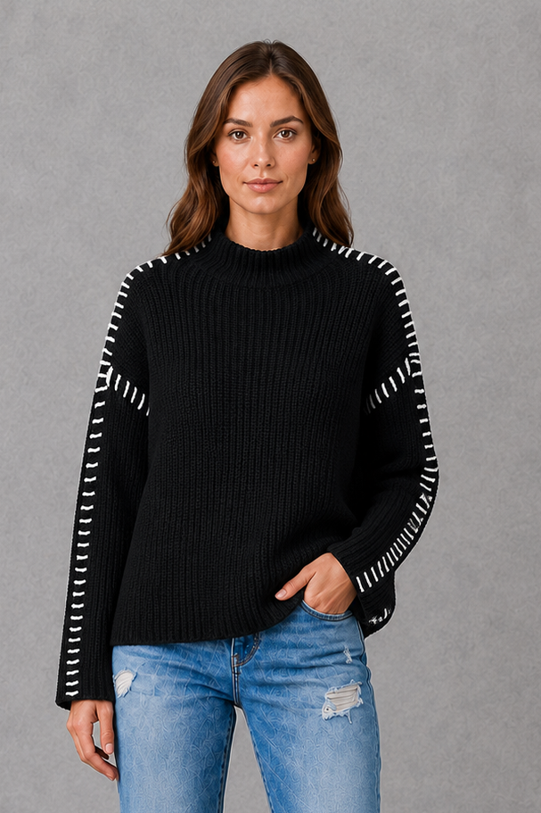 Women’s oversized black crew neck knit jumper with white contrast stitch detailing across the shoulders and long sleeves.