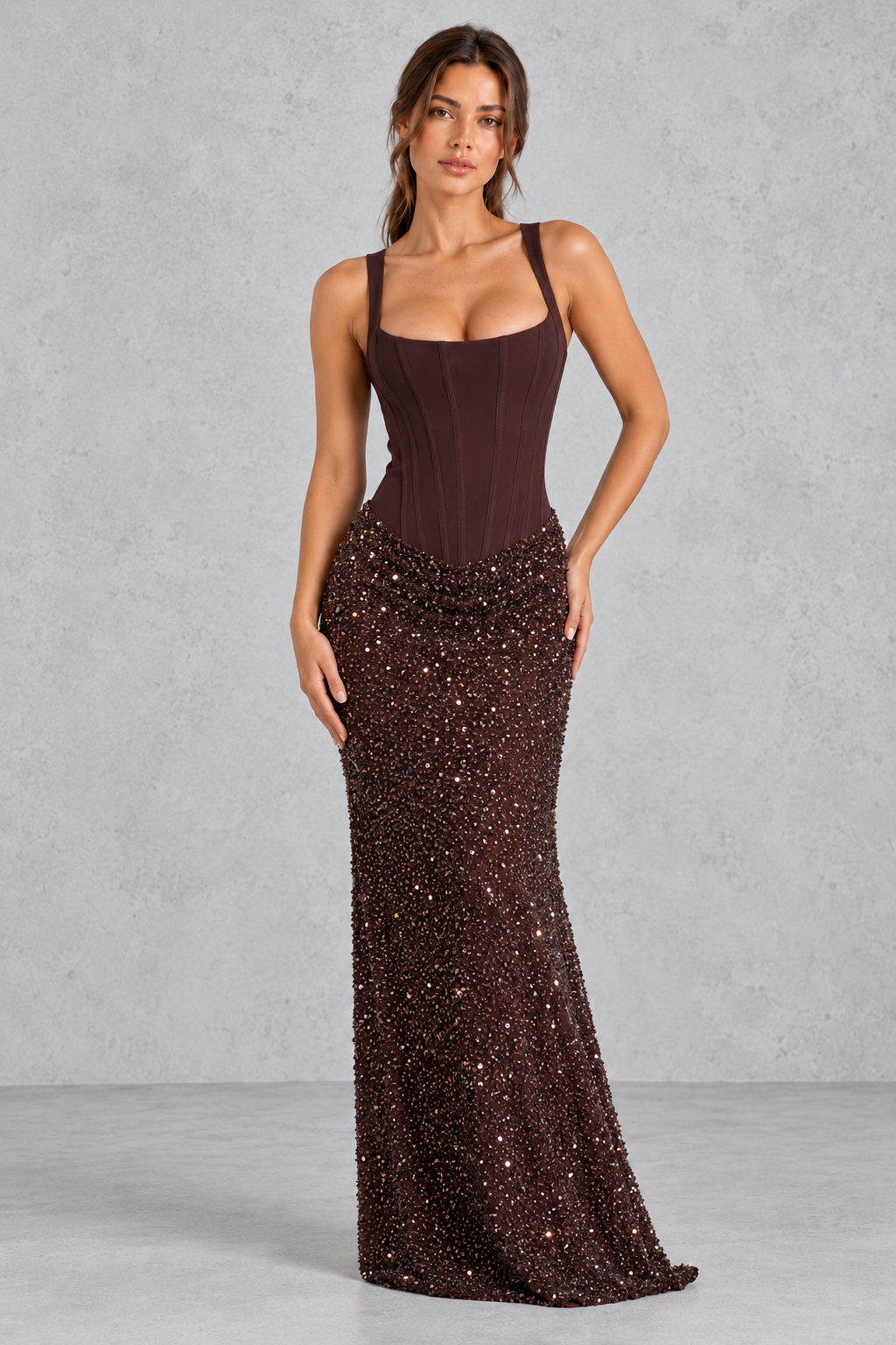 Women’s corset maxi dress with a structured crepe bodice, square neckline, adjustable straps and embellished tulle cowl skirt.