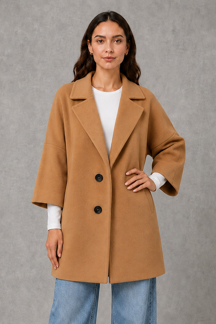 Women’s elegant longline coat with a classic tailored silhouette and lightweight finish, ideal for polished spring and autumn layering.