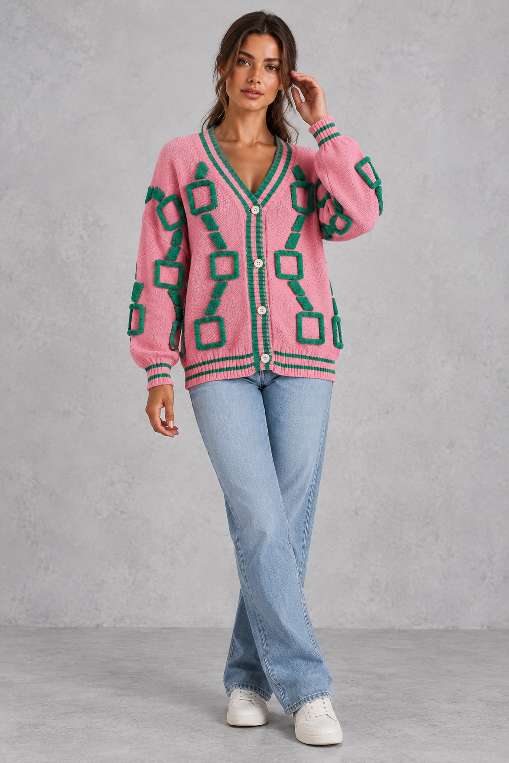 Women’s geometric knit cardigan with a deep V-neckline, button front, dropped shoulders and contrast striped ribbed trims.