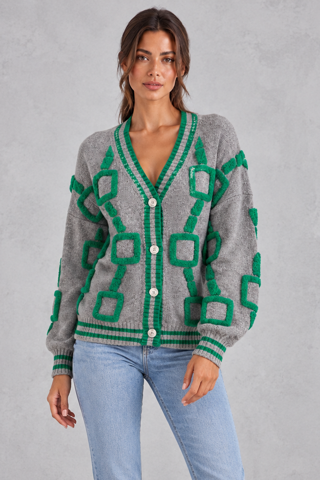 Women’s geometric knit cardigan with a deep V-neckline, button front, dropped shoulders and contrast striped ribbed trims.