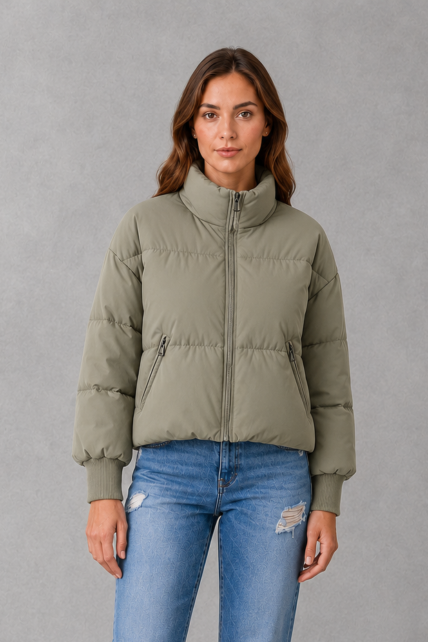 Women’s high collar quilted puffer jacket with lightweight padding, full zip fastening and practical side pockets for everyday winter wear.