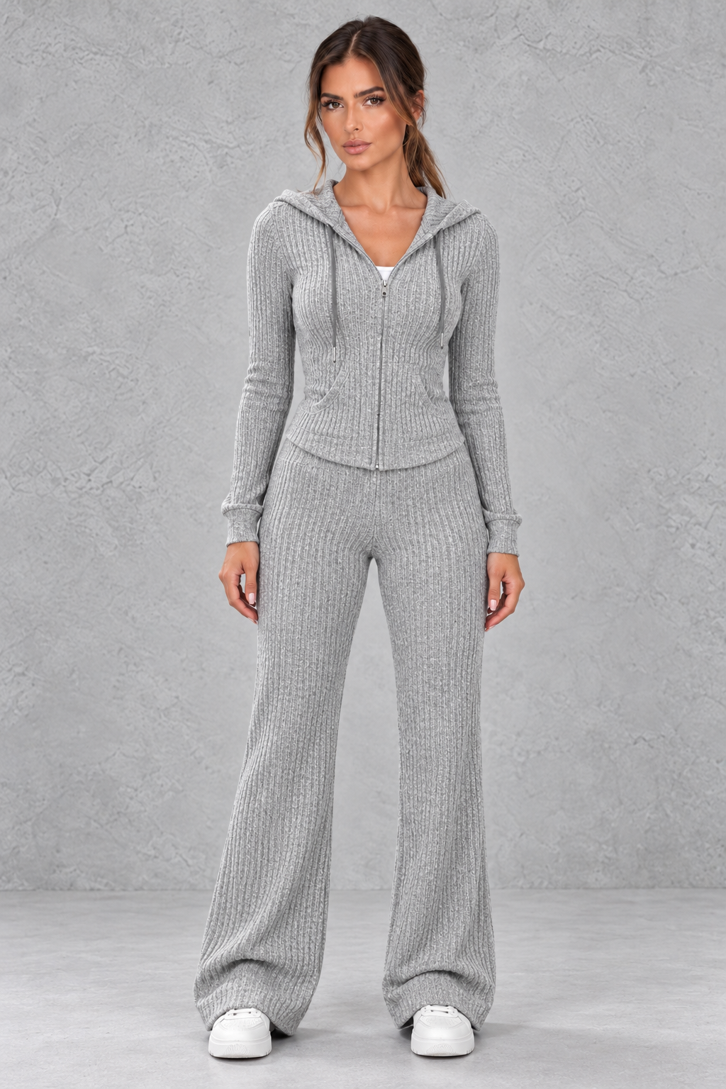 Women’s ribbed knit two-piece co-ord set with a fitted hooded zip-up top, adjustable drawstrings and matching wide leg trousers.
