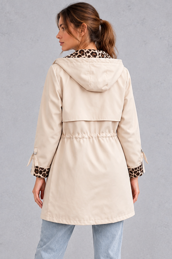 Women's cream hooded windproof jacket with drawstring waist – back view