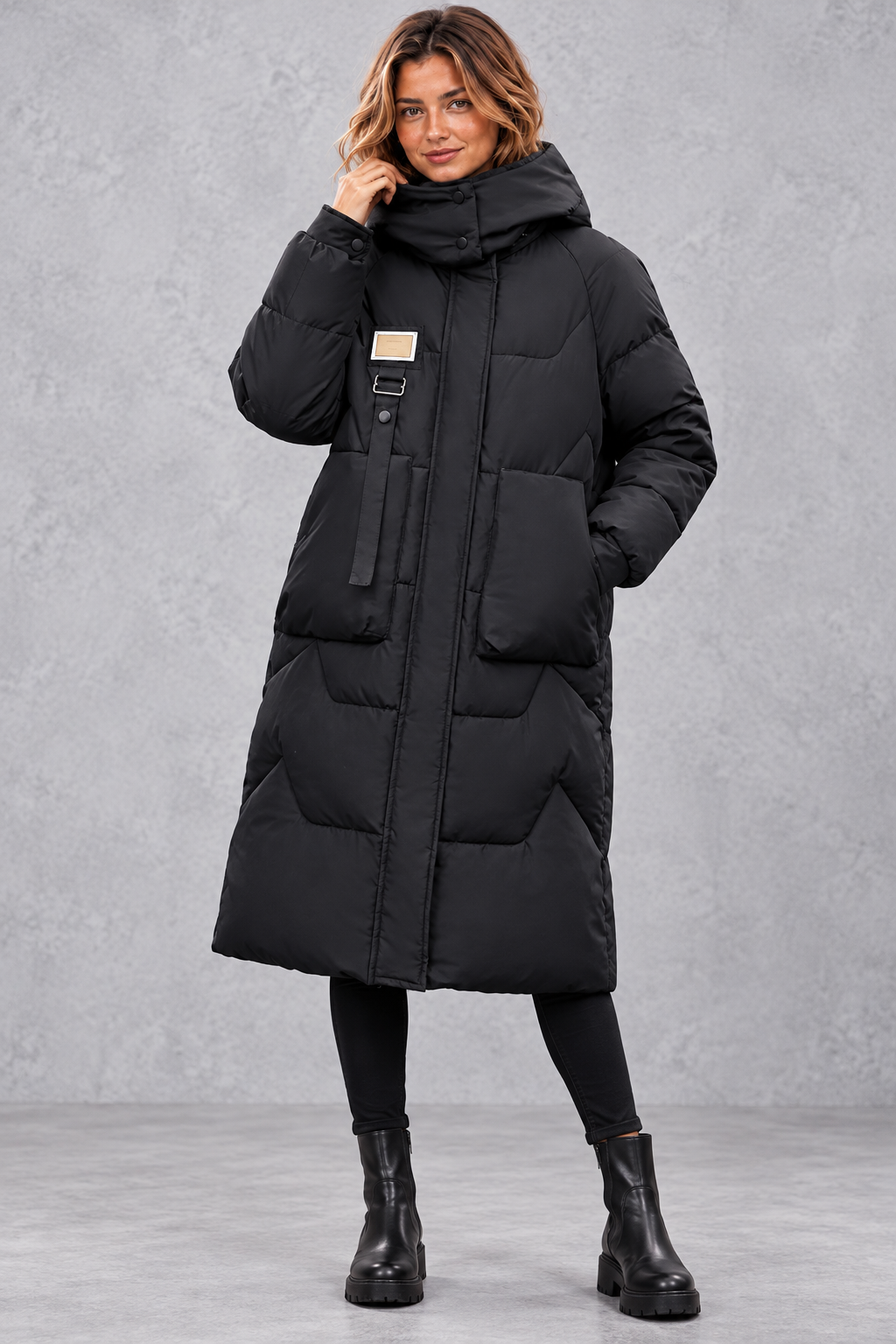 Women's long hooded puffer coat in Black – front view