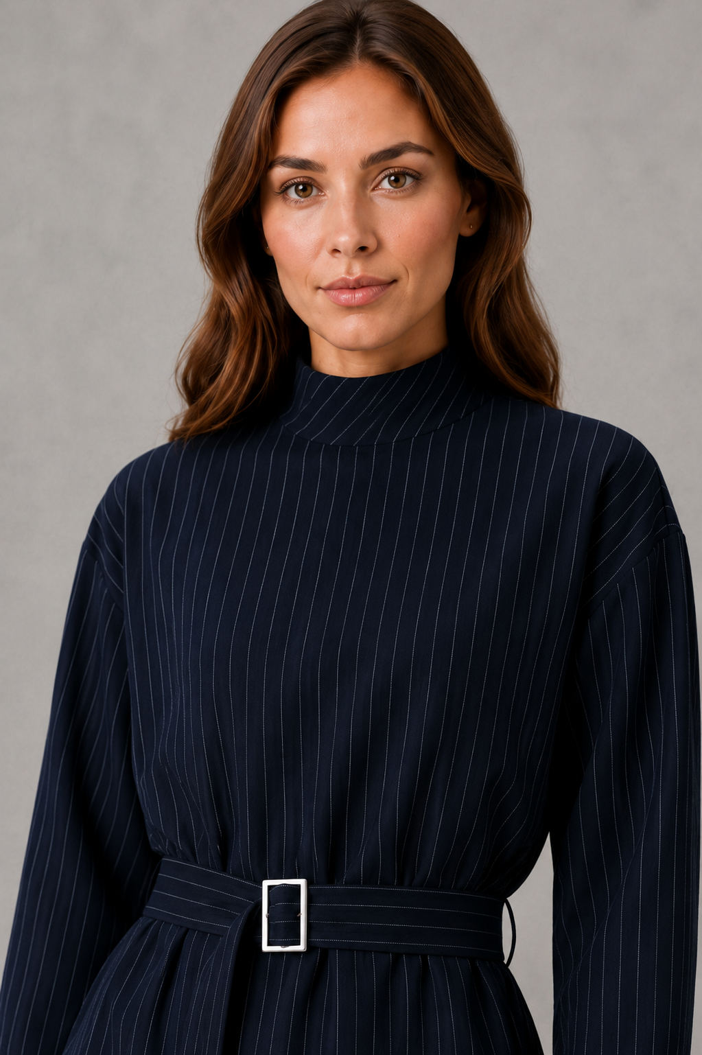 Women’s navy pinstripe two piece set with belted high neck long-sleeve top and matching wide leg palazzo trousers.