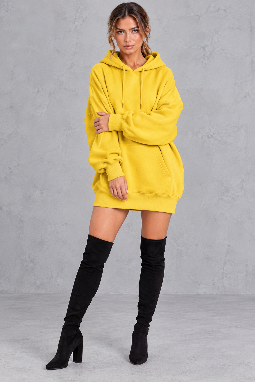 Women's yellow oversized hoodie mini dress with drawstring hood and kangaroo pocket – front view