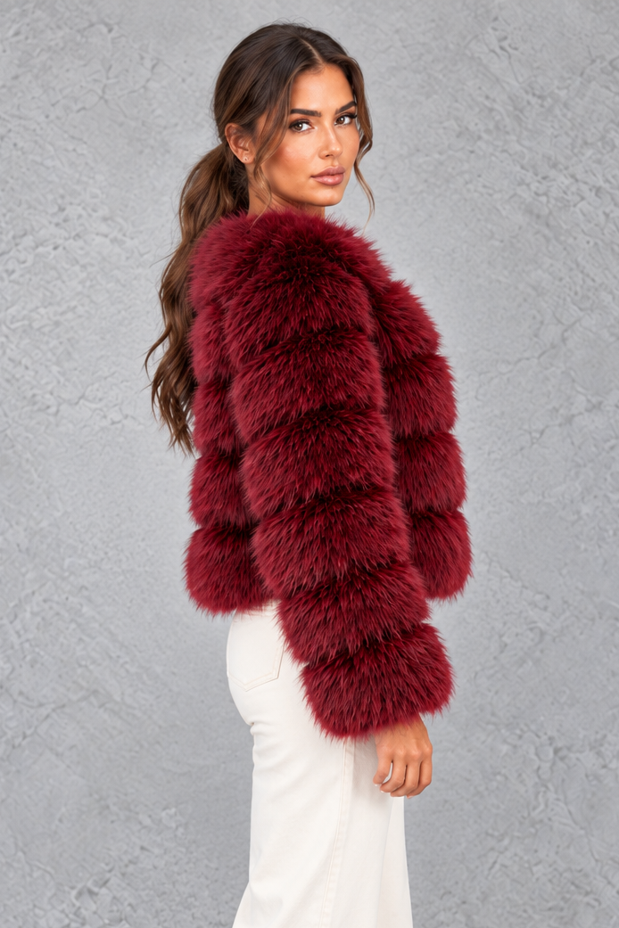 Women’s plush cropped faux fur winter jacket with a rounded neckline, long sleeves and a soft voluminous silhouette.