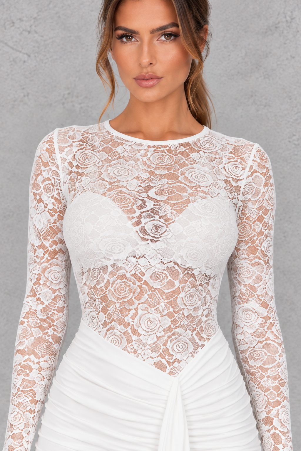 Women’s sheer lace bodycon dress with a round neckline, long sleeves, delicate lace detailing and a sleek fitted silhouette.