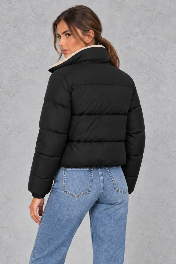 Women’s padded puffer jacket with a soft sherpa-lined high neck, horizontal quilting, full zip front and elasticated cuffs.