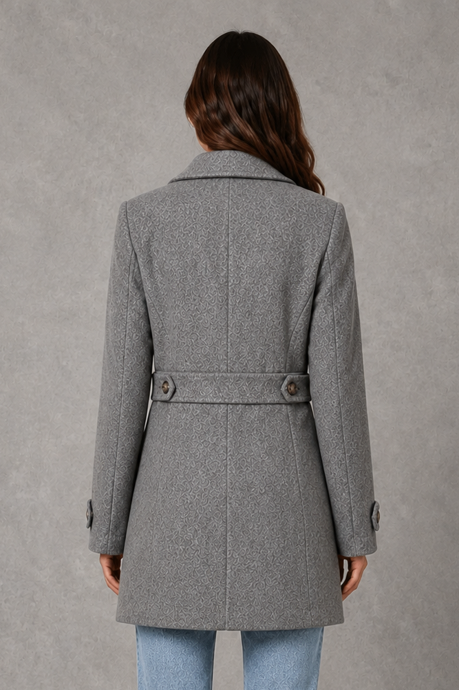 Women’s tailored longline coat with a classic collar, button-front fastening, defined waist, decorative waist tabs and button cuff detailing.