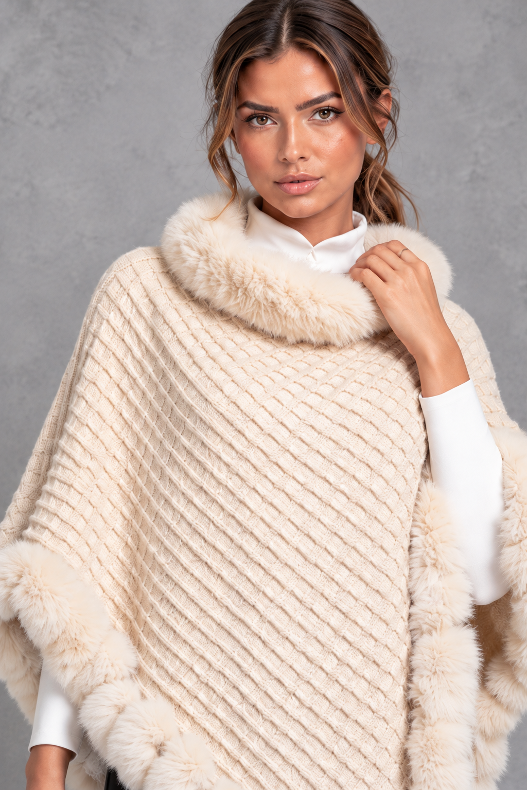 Women's textured knitted poncho in Cream – close-up