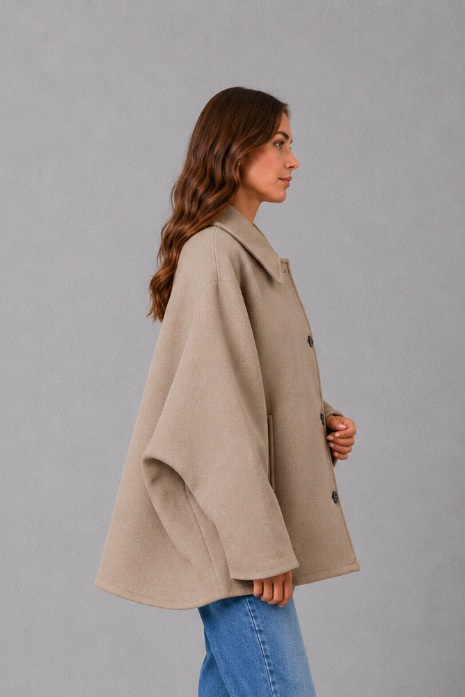 Women’s vintage casual longline coat with a relaxed silhouette, practical front pockets and timeless retro-inspired styling for cooler weather.