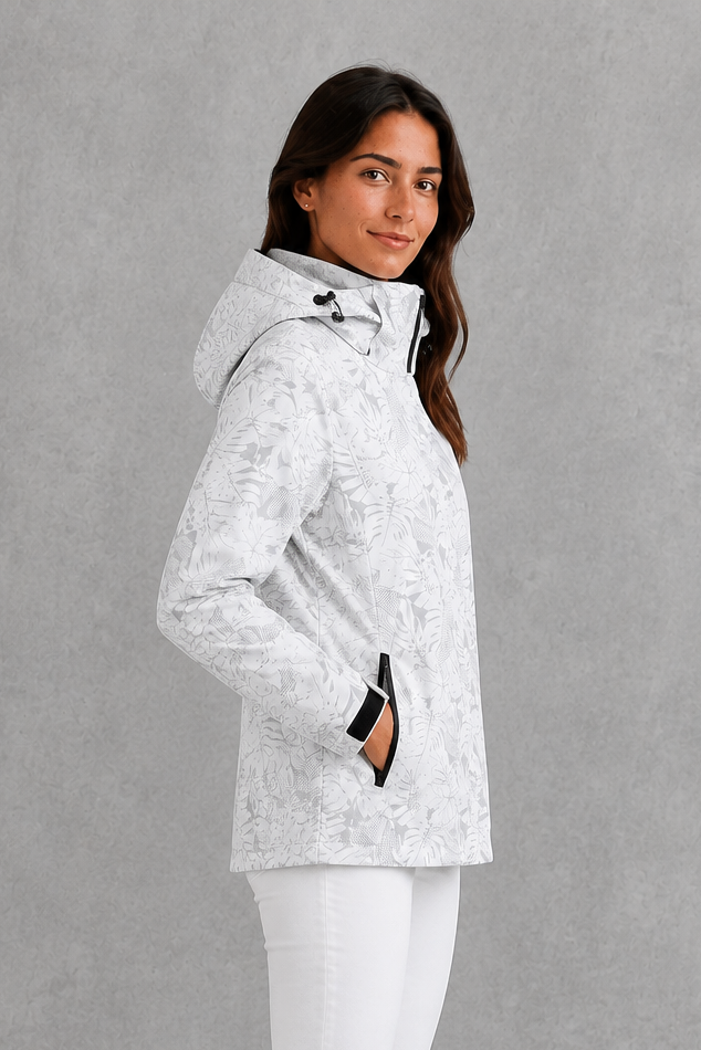 Women’s waterproof leaf print jacket with a protective hood, adjustable drawstring waist and lightweight design for rainy and changeable weather.
