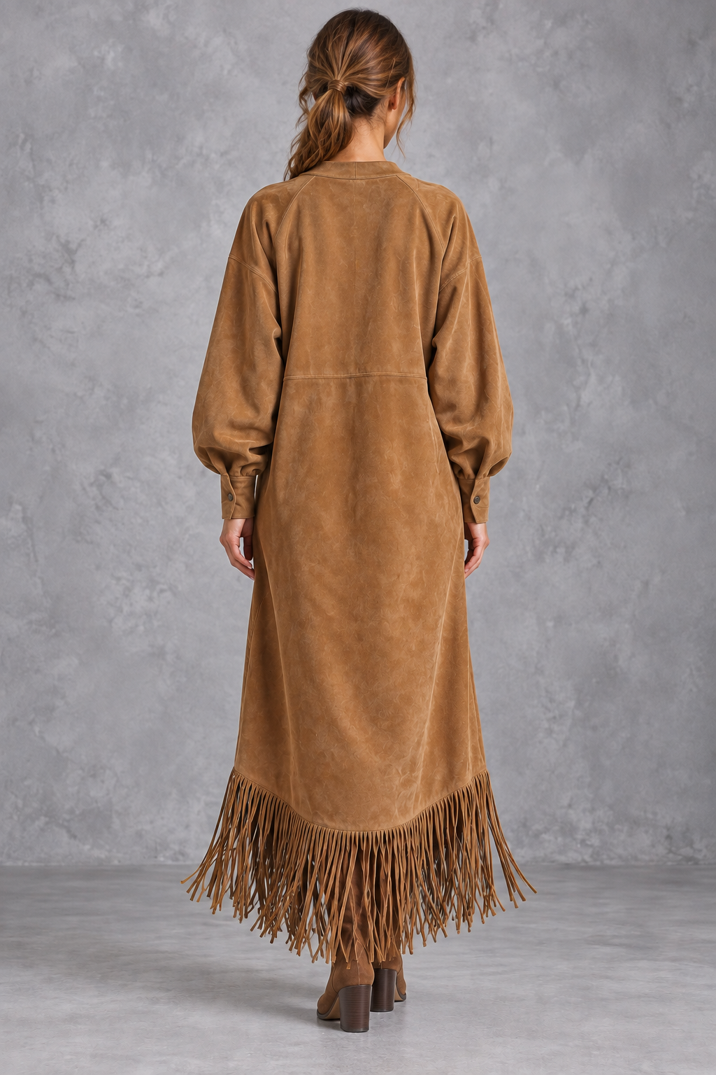Women’s Western faux suede midi dress with a round neckline, decorative tassel detailing and a relaxed A-line silhouette.