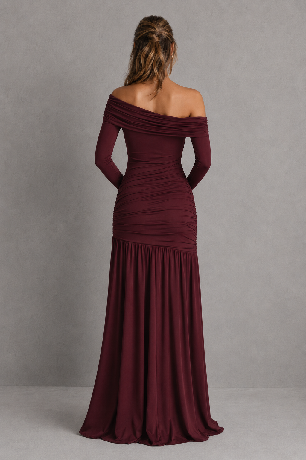 Burgundy off-shoulder evening gown on a plain background