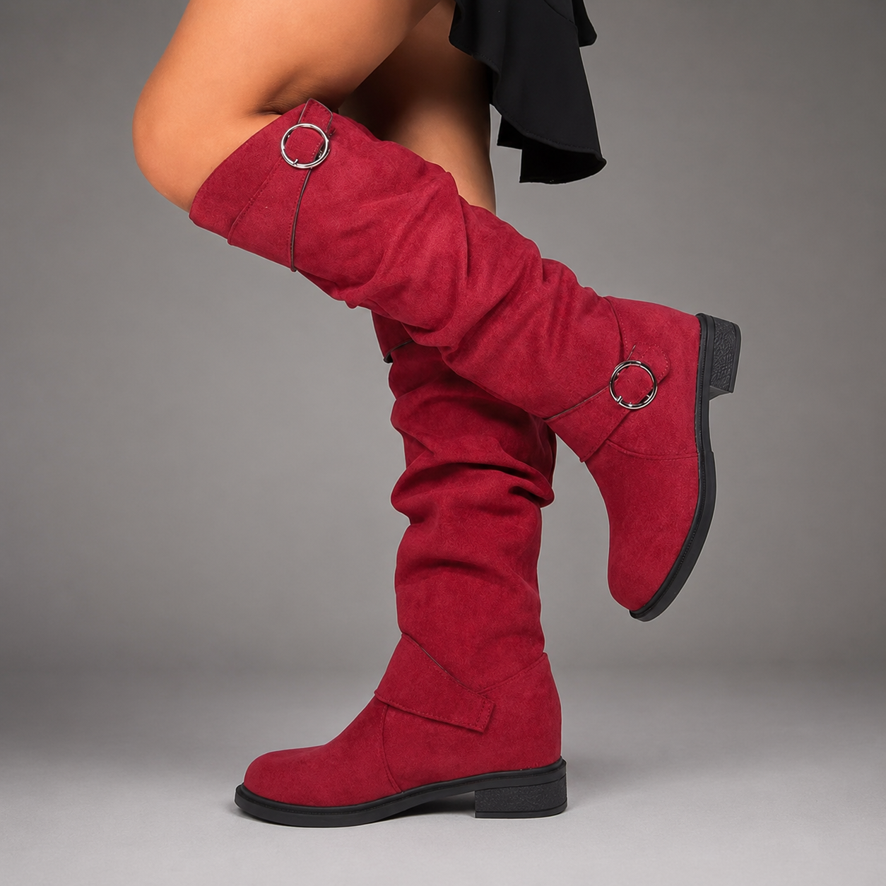 Women's black mid-calf slouch boots with decorative buckle accents, soft synthetic upper, slip-on design and durable rubber sole, styled for everyday casual wear.