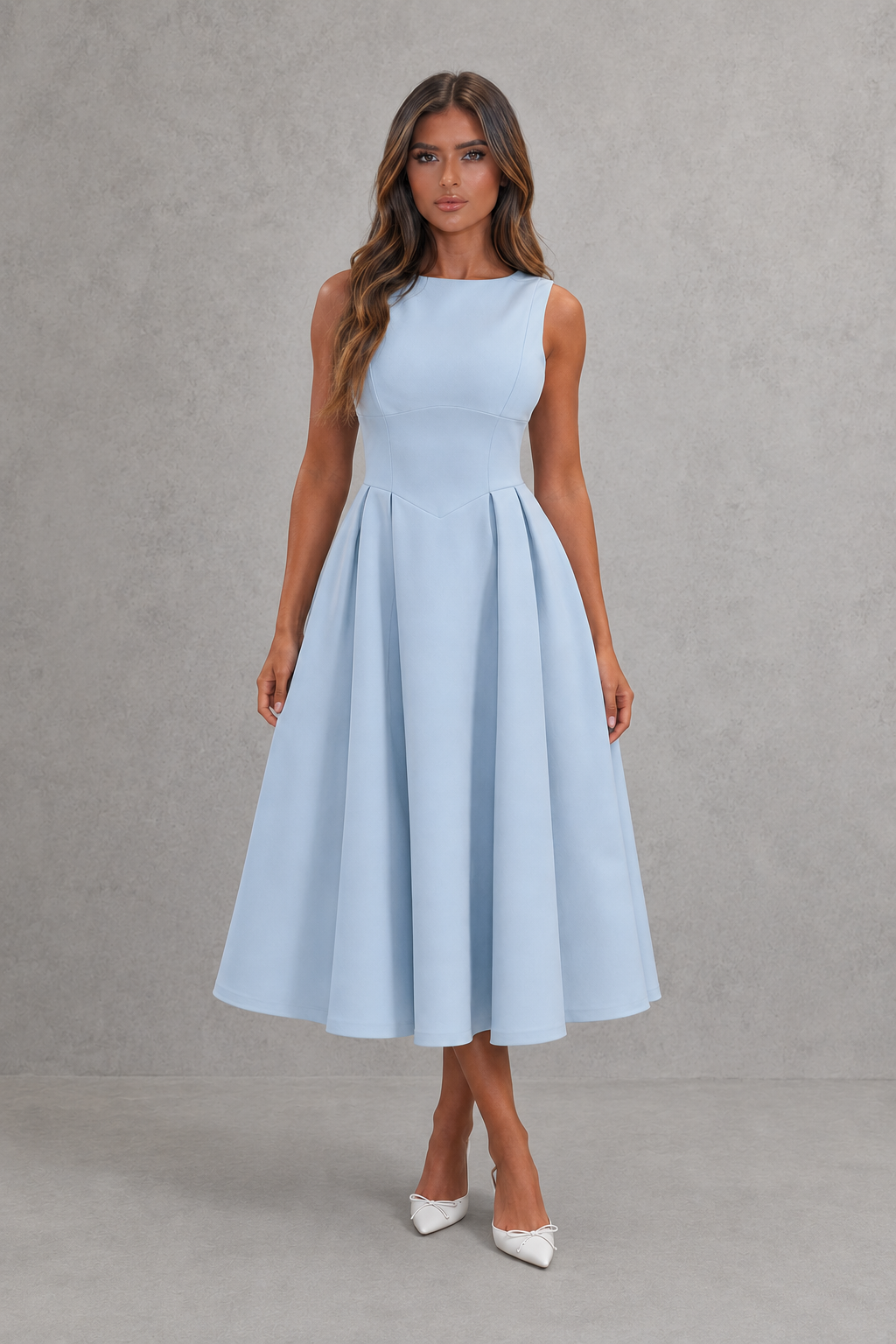 Woman wearing a light blue dress against a gray background