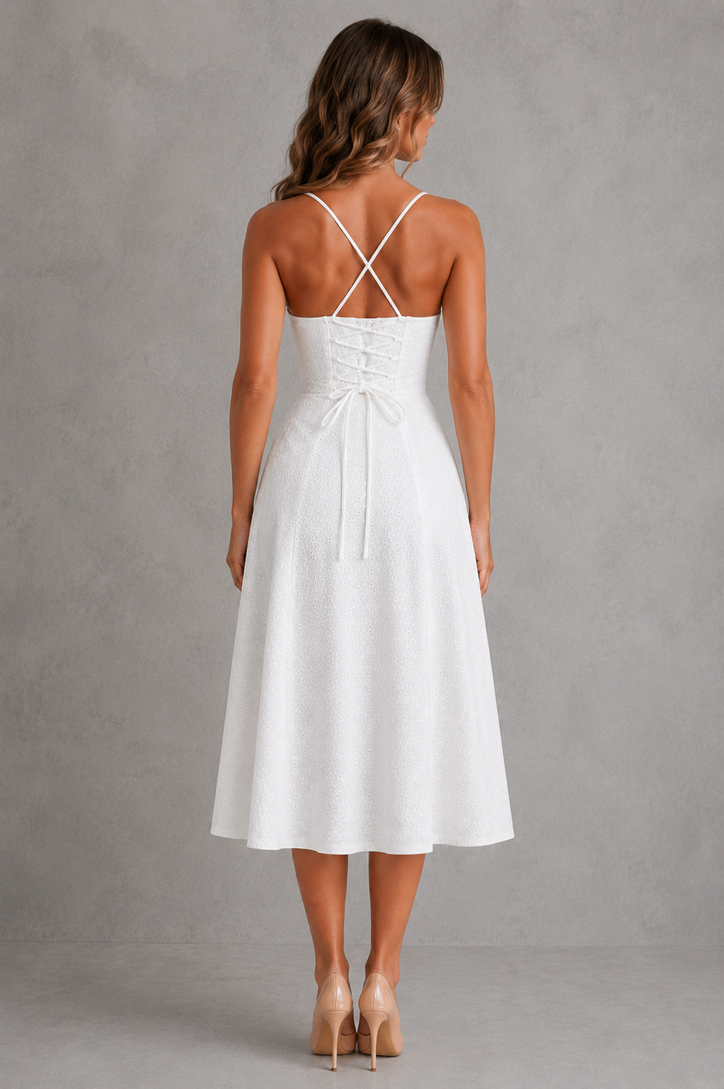 White dress with thin straps on a gray background