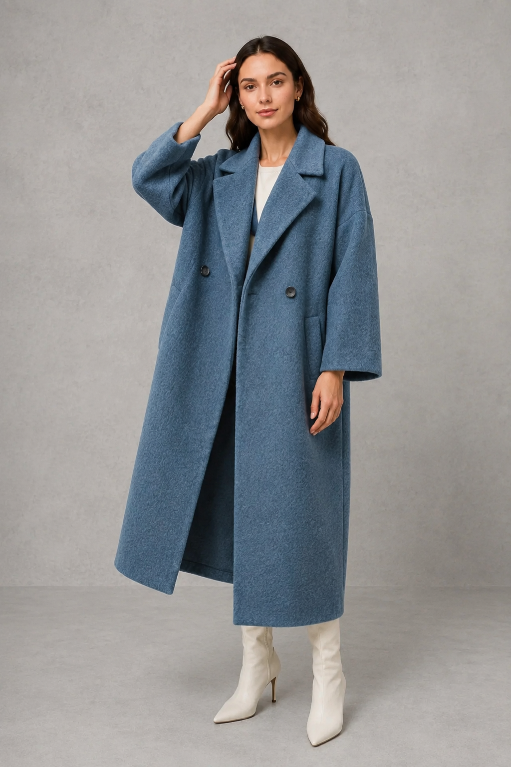 Women’s classic wool maxi coat with a relaxed longline silhouette, minimalist styling and traditional front button fastening for autumn and winter.