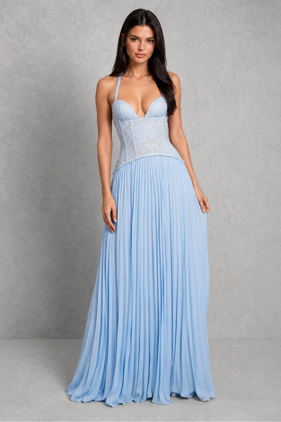 Woman wearing a light blue evening gown against a gray background