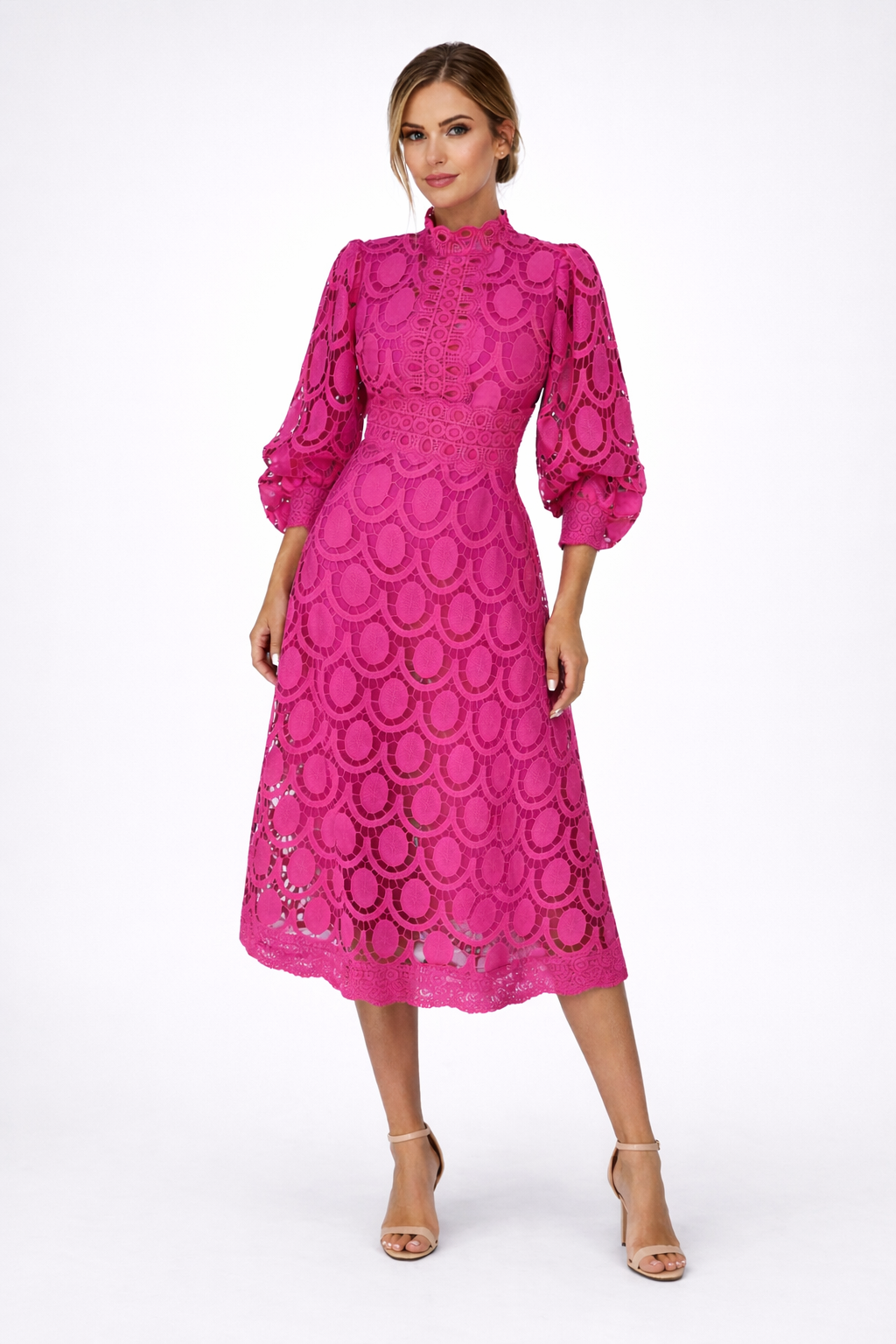 Woman wearing a pink lace dress on a white background