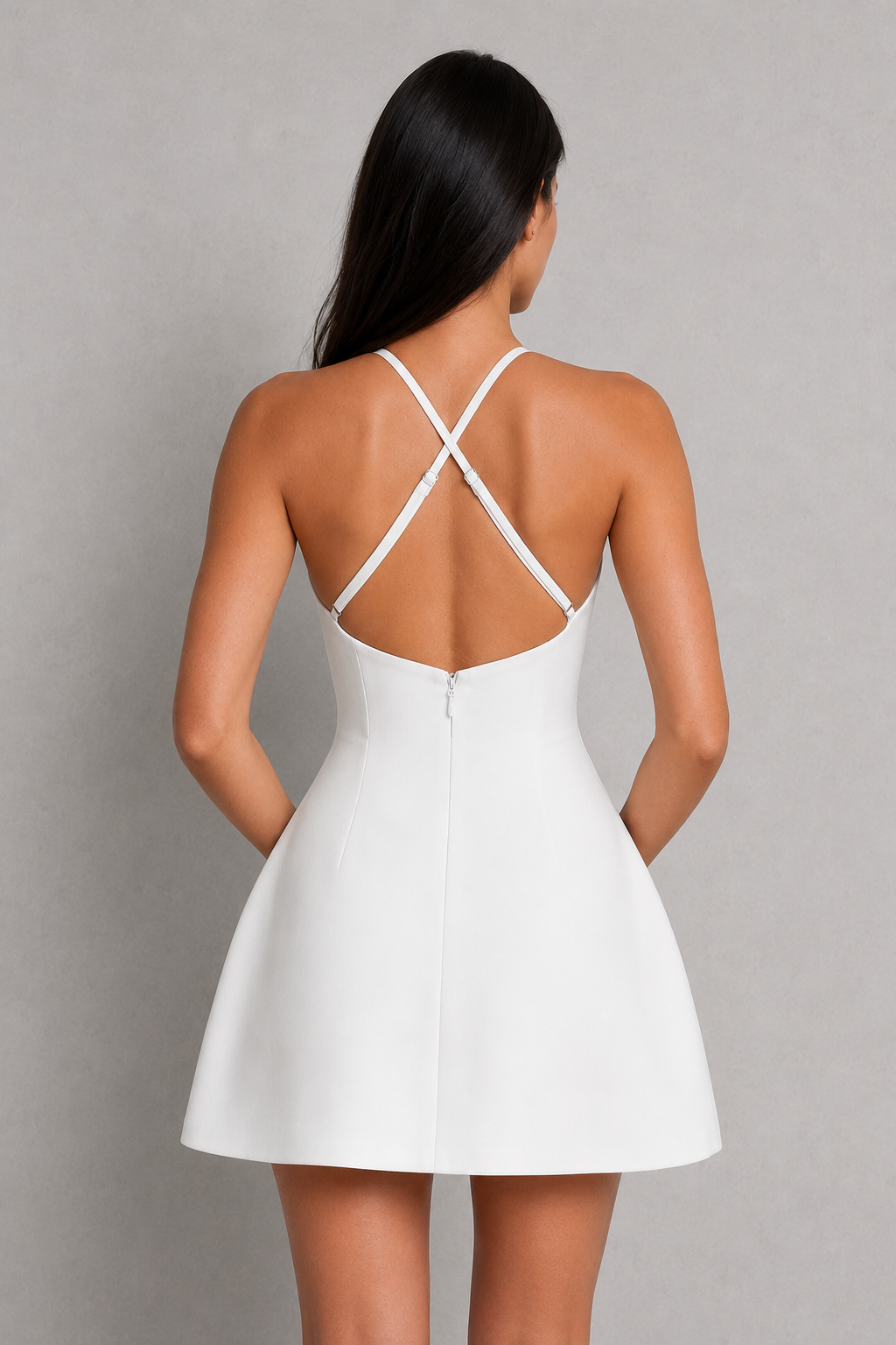 White dress with thin straps on a gray background