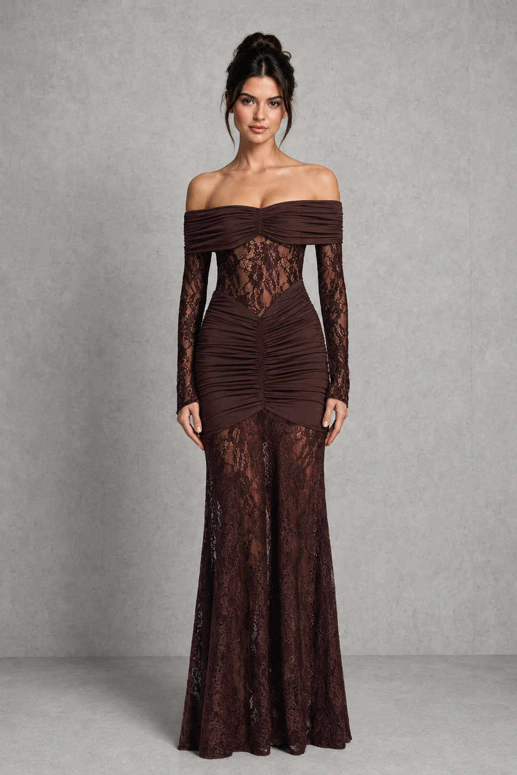 Woman wearing a brown lace off-shoulder gown against a gray background
