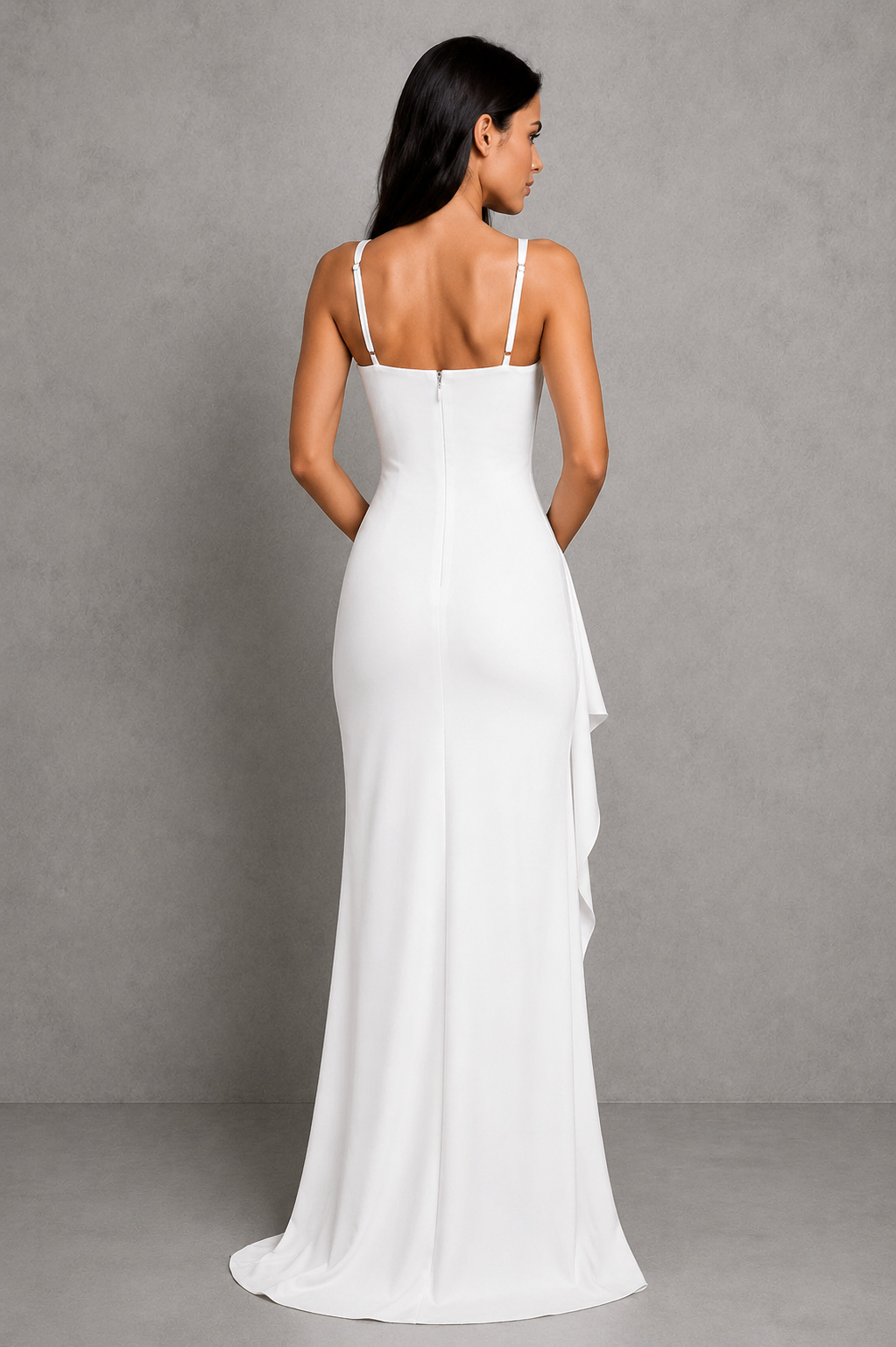 Woman wearing a white evening gown against a gray background