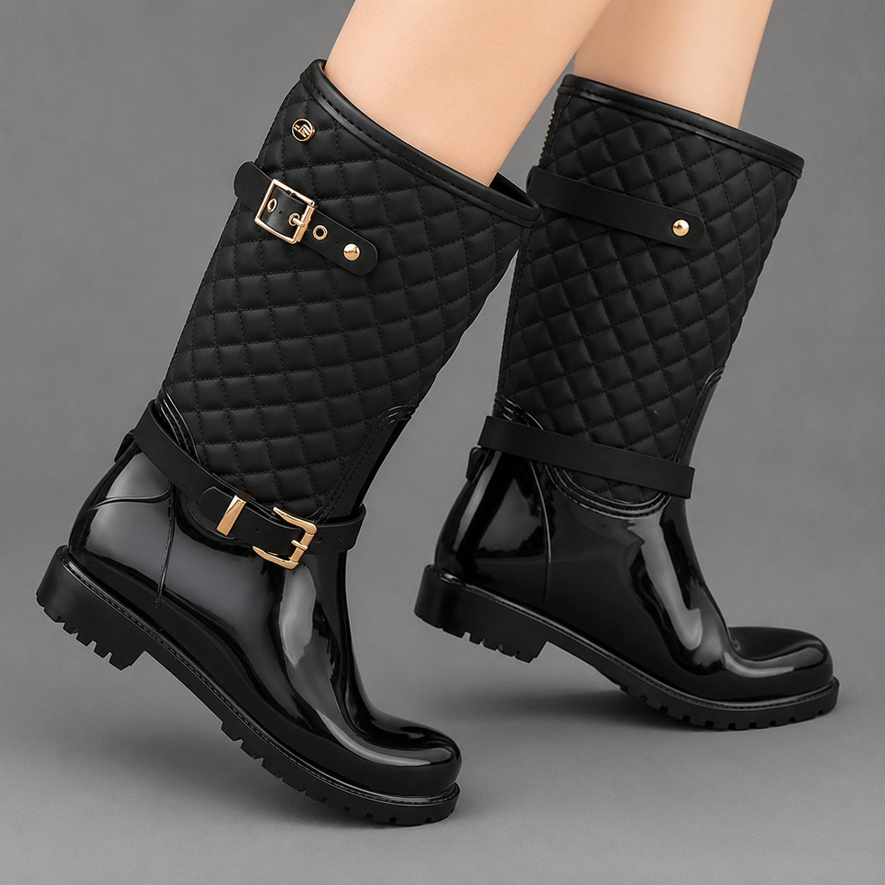 Women's quilted plaid mid-calf rain boots with a waterproof PVC upper, decorative side buckle, round toe and non-slip rubber sole, designed as comfortable slip-on Wellington boots for rainy days, gardening and outdoor wear.