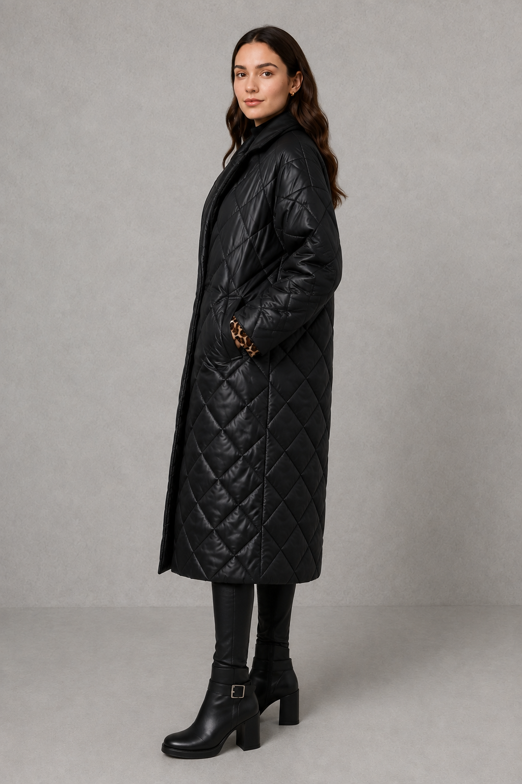 Women’s reversible quilted mid-length coat with a classic plain quilted side and bold leopard-print reverse, featuring lapels and side pockets.