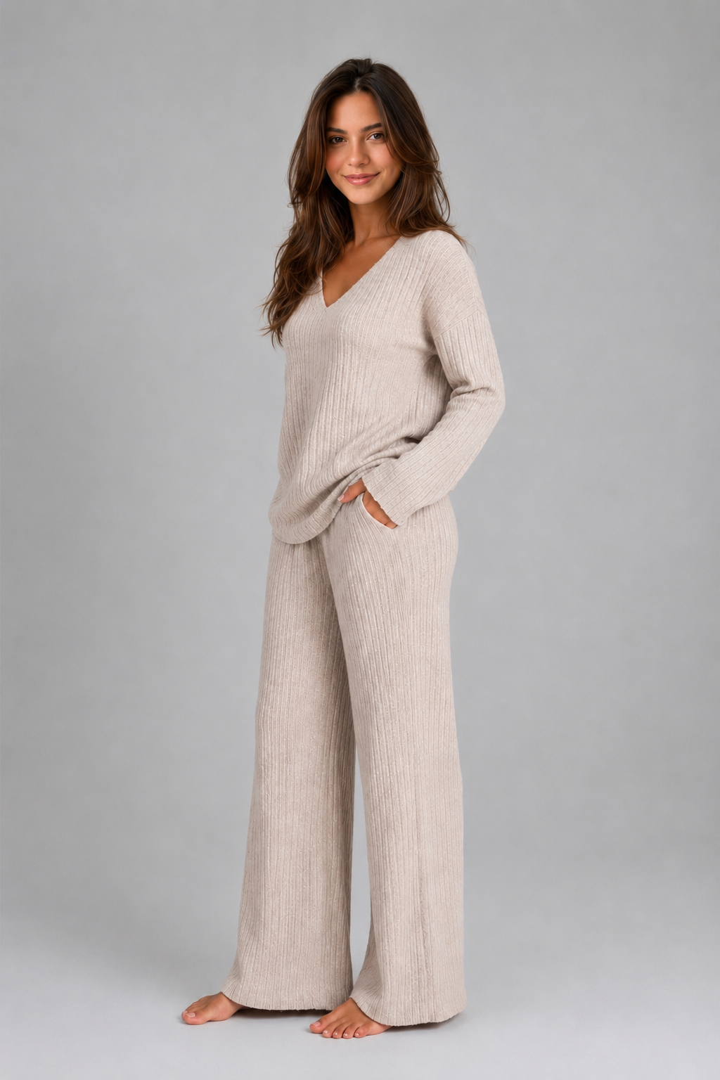 Women's ribbed knit lounge set featuring a relaxed V-neck jumper and matching wide leg trousers in a soft stretch knit, designed for cosy everyday comfort and casual wear.