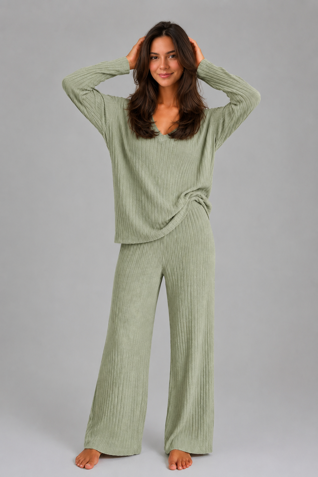 Women's ribbed knit lounge set featuring a relaxed V-neck jumper and matching wide leg trousers in a soft stretch knit, designed for cosy everyday comfort and casual wear.