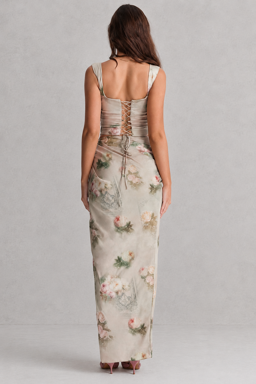 Woman wearing a floral dress with a gray background