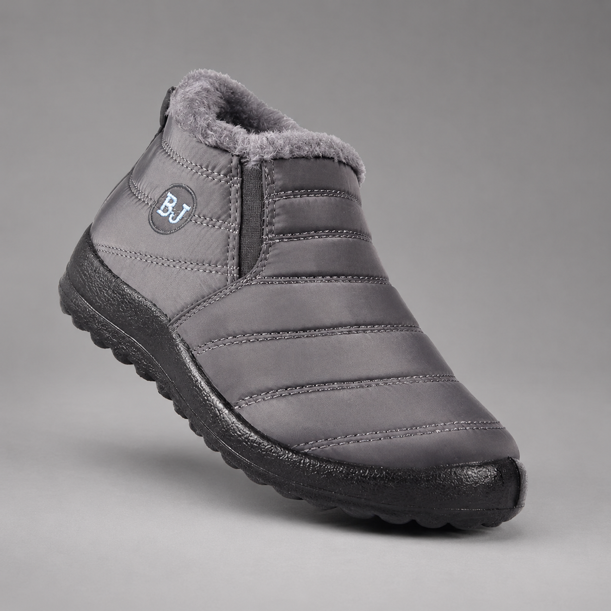 Women's waterproof faux fur-lined ankle snow boots with a quilted upper, lightweight slip-on design, round toe and durable non-slip sole, providing warm, comfortable and weather-resistant winter footwear for everyday outdoor wear.