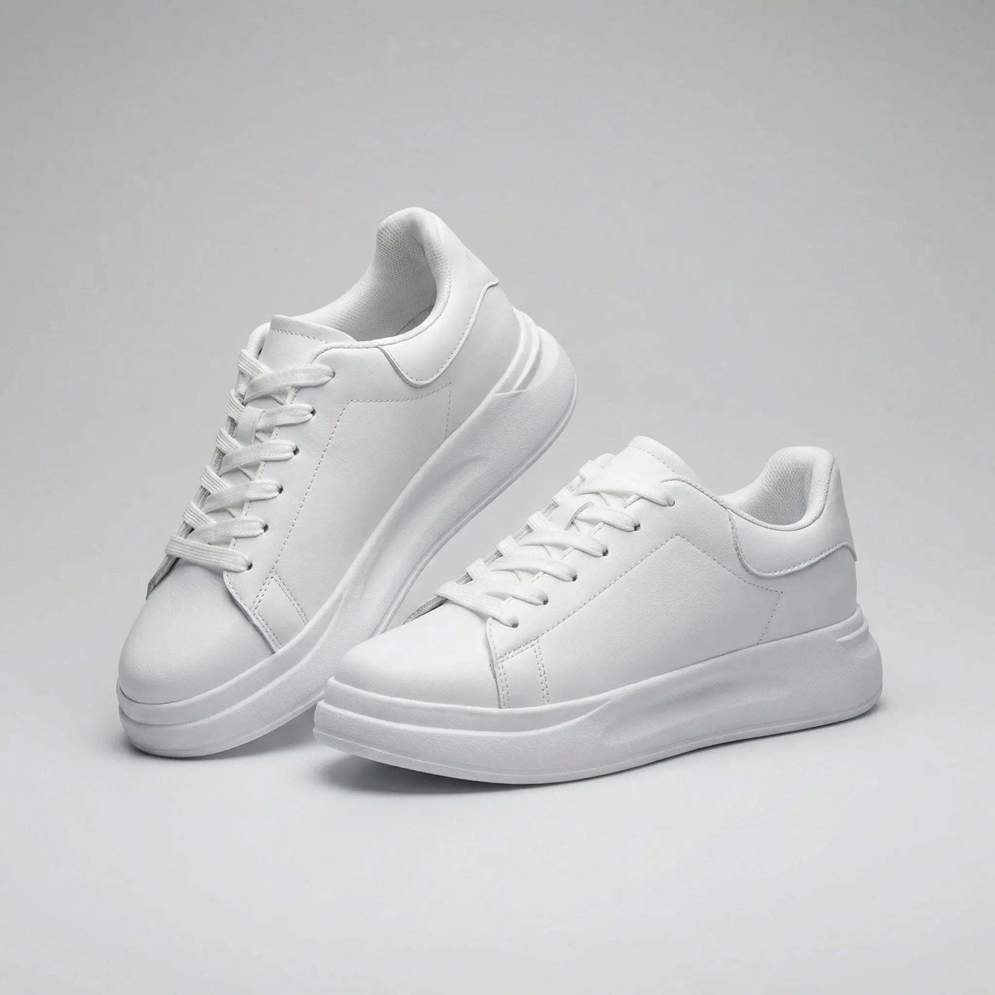 Pair of white sneakers on a gray background1