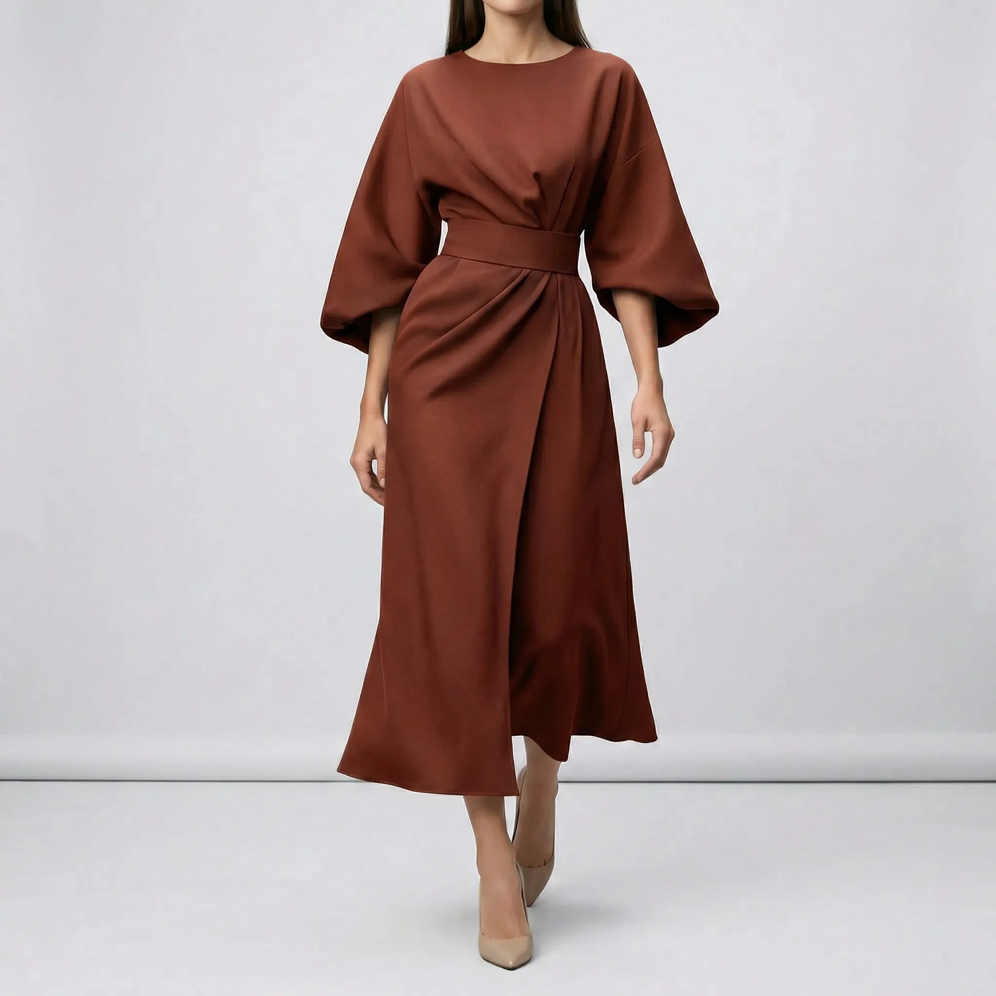 Brown dress worn by a model on a white background