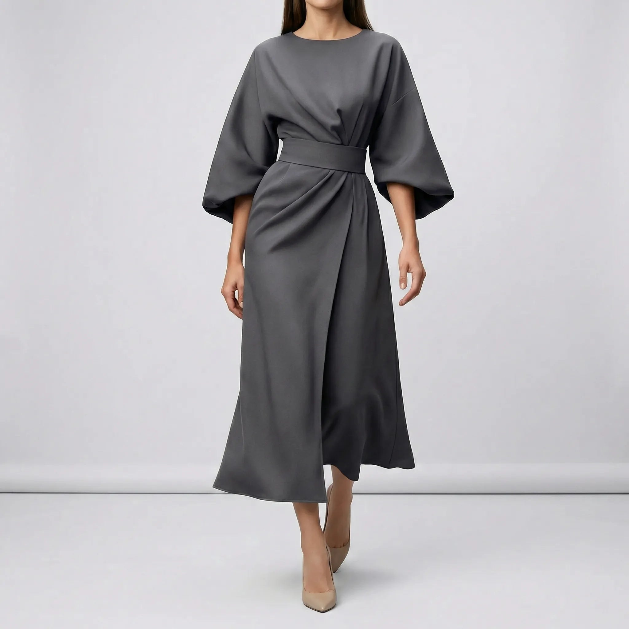 Gray dress with wide sleeves on a plain background