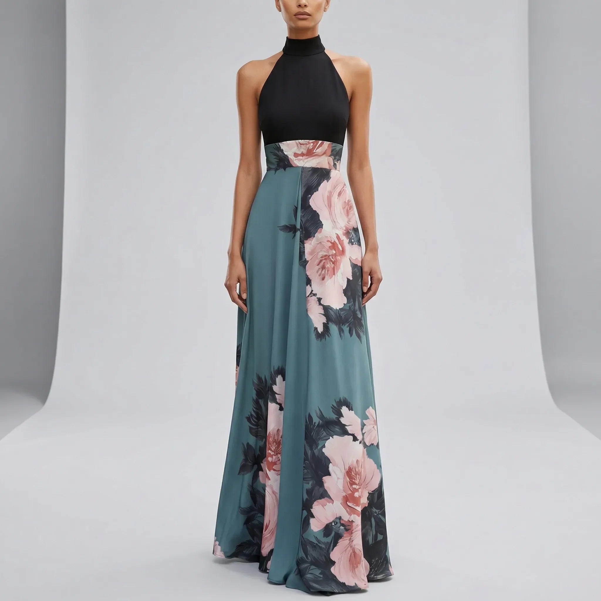 Woman wearing a black top and floral dress on a gray background1