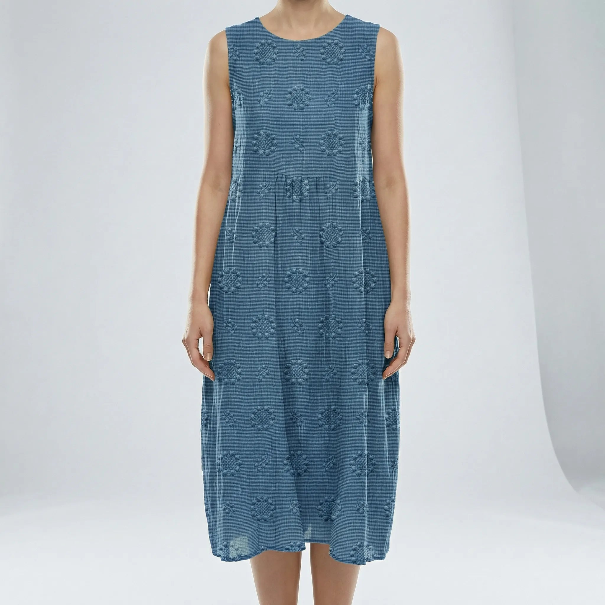 Blue sleeveless dress with floral patterns on a white background