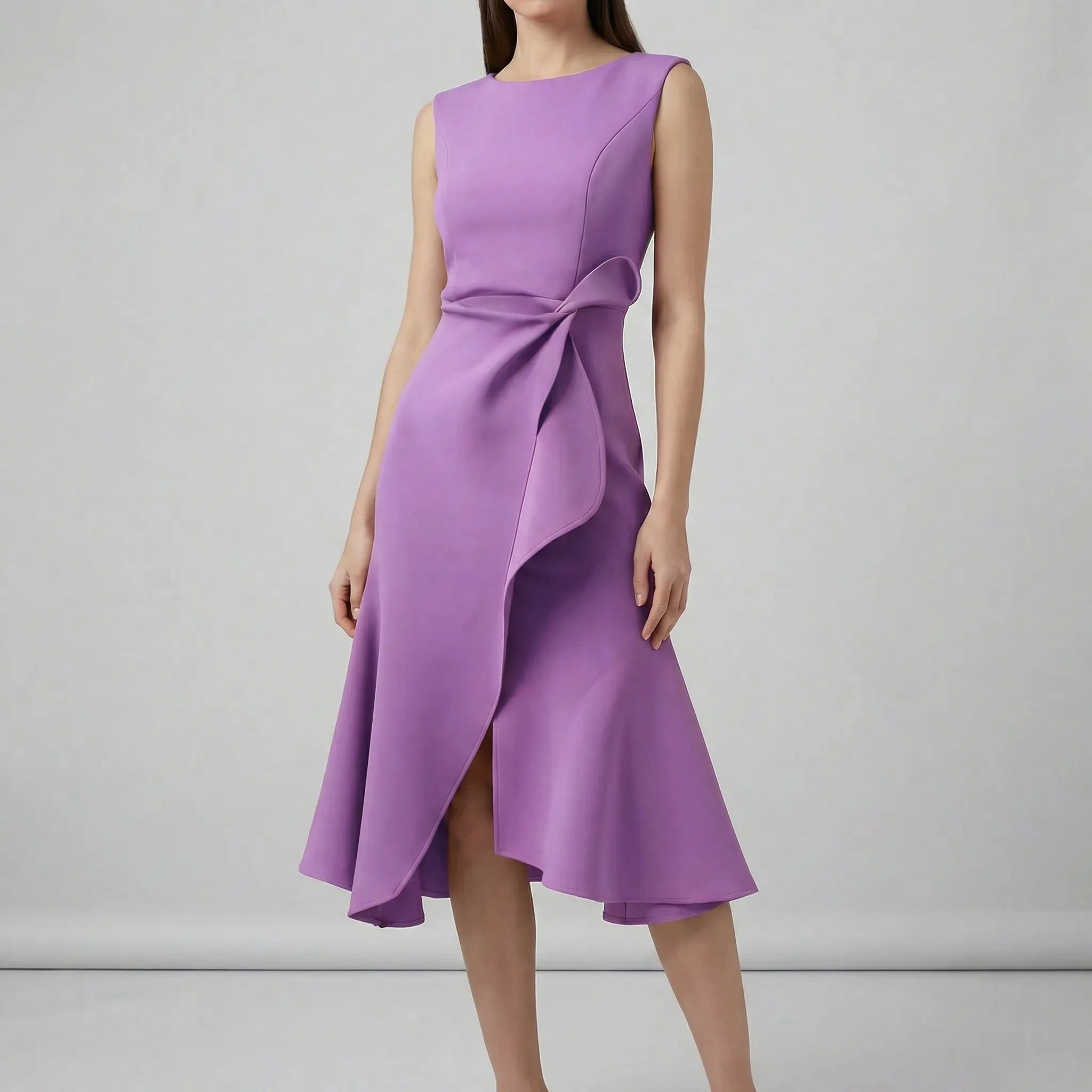 Purple dress with a bow detail on a gray background