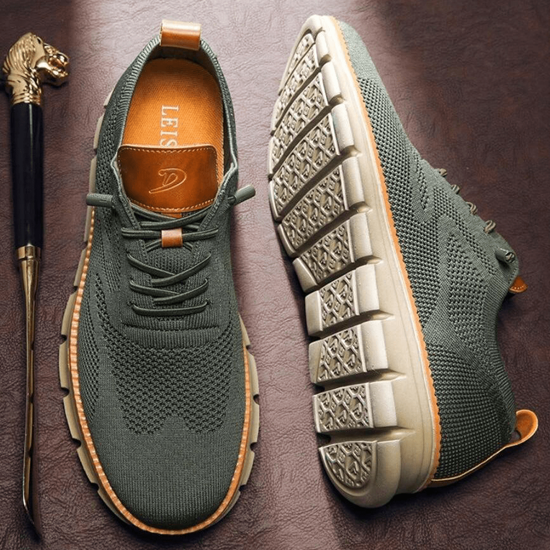 Green sneakers with brown accents on a dark surface